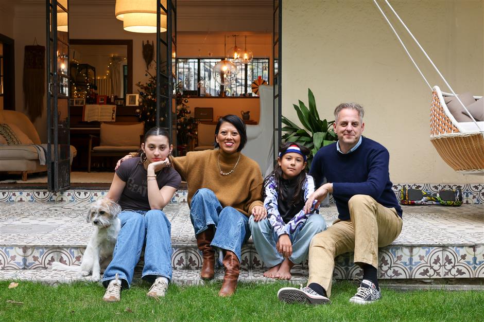 expat family at home in cozy garden apartment tucked inside a shanghai lane
